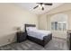 Cozy bedroom with a neutral palette and a window bringing in natural light at 1935 E Seminole Dr, Phoenix, AZ 85022