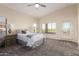 Inviting bedroom with a vaulted ceiling, carpet, and abundant natural light at 1935 E Seminole Dr, Phoenix, AZ 85022
