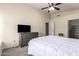 Spacious bedroom with ample natural light, ceiling fan, and an en-suite at 1935 E Seminole Dr, Phoenix, AZ 85022