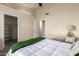 Bright bedroom featuring a desk and doorway leading to a walk-in closet at 1935 E Seminole Dr, Phoenix, AZ 85022