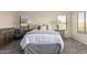 Cozy bedroom features a neutral color scheme, soft carpet, and window views at 1935 E Seminole Dr, Phoenix, AZ 85022