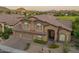 Beautiful home featuring a three-car garage, tiled roof, and attractive desert landscaping at 1935 E Seminole Dr, Phoenix, AZ 85022