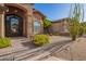 Charming front entrance with decorative door, landscaped desert plants and walkway at 1935 E Seminole Dr, Phoenix, AZ 85022