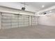 Clean and spacious garage with multiple garage door openers and overhead lighting at 1935 E Seminole Dr, Phoenix, AZ 85022