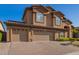Spacious three-car garage with brick driveway and well-maintained landscaping, showcasing the home's curb appeal at 1935 E Seminole Dr, Phoenix, AZ 85022