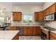 Kitchen features a convenient layout with modern appliances and views to the dining area at 1935 E Seminole Dr, Phoenix, AZ 85022