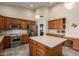 Large kitchen featuring stainless steel appliances, island, and convenient layout at 1935 E Seminole Dr, Phoenix, AZ 85022