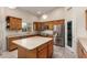 Spacious kitchen with an island, stainless steel appliances, and ample cabinet space at 1935 E Seminole Dr, Phoenix, AZ 85022