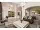 Spacious living room featuring high ceilings, elegant decor, and tile flooring at 1935 E Seminole Dr, Phoenix, AZ 85022