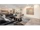 Large living room featuring an open layout with a sectional sofa, tile floors, and views into the kitchen at 1935 E Seminole Dr, Phoenix, AZ 85022
