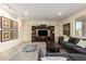 Relaxing living room with neutral walls, tile floors, and a large entertainment center at 1935 E Seminole Dr, Phoenix, AZ 85022