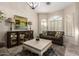 Cozy living room with shuttered windows, a decorative cabinet, and comfortable seating at 1935 E Seminole Dr, Phoenix, AZ 85022