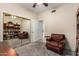 Office space includes comfortable armchair, bookcase and natural light at 1935 E Seminole Dr, Phoenix, AZ 85022