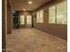 A covered brick patio features backyard access, natural light and provides ample space for seating and entertaining at 1935 E Seminole Dr, Phoenix, AZ 85022