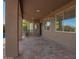 Covered patio with brick pavers offers an outdoor living space near the pool at 1935 E Seminole Dr, Phoenix, AZ 85022
