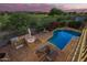 Aerial view of a private pool and patio area, complete with an outdoor kitchen and lounge chairs at 1935 E Seminole Dr, Phoenix, AZ 85022