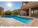 Sparkling pool with clear blue water and a large patio, ideal for summer relaxation and entertaining at 1935 E Seminole Dr, Phoenix, AZ 85022