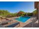 Inviting backyard pool featuring lounge chairs and desert plants, perfect for relaxing and entertaining at 1935 E Seminole Dr, Phoenix, AZ 85022