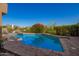 Beautiful pool with cool, clear water with lush landscaping adding to the appeal of this outdoor space at 1935 E Seminole Dr, Phoenix, AZ 85022