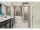 Bathroom with double sinks, large soaking tub, and a door to the toilet and closet at 226 E Monza Way, San Tan Valley, AZ 85140