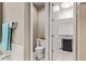 This half bath includes a toilet, a closet, and a vanity for extra storage at 226 E Monza Way, San Tan Valley, AZ 85140