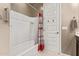 Bright white bathroom showcases a tub and shower combination and tile surround at 226 E Monza Way, San Tan Valley, AZ 85140