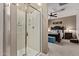 Glass enclosed shower in the bathroom next to the beautifully decorated bedroom at 226 E Monza Way, San Tan Valley, AZ 85140