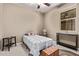 Bedroom with twin bed, ceiling fan, and small wood trunk at 226 E Monza Way, San Tan Valley, AZ 85140