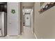 Hallway with tile flooring and access to various rooms, including a view of the front door at 226 E Monza Way, San Tan Valley, AZ 85140
