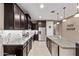 An elegant kitchen equipped with stainless steel appliances and lots of countertop space at 226 E Monza Way, San Tan Valley, AZ 85140