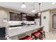 Modern kitchen features granite countertops, stainless steel appliances, and bar stool seating at 226 E Monza Way, San Tan Valley, AZ 85140