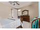 Comfortable main bedroom features a ceiling fan and an ensuite bathroom at 226 E Monza Way, San Tan Valley, AZ 85140