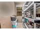 Organized pantry with shelving for ample storage, enhancing kitchen efficiency at 226 E Monza Way, San Tan Valley, AZ 85140