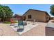 Spacious backyard patio features gravel, an outdoor firepit, and comfortable seating at 226 E Monza Way, San Tan Valley, AZ 85140
