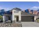 Modern single-story home with a neutral color palette, a two-car garage, and stunning mountain views at 2325 S 125Th Dr, Avondale, AZ 85323