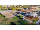 Aerial shot of a community park with playground, sand volleyball court, green spaces, and walking paths at 2325 S 125Th Dr, Avondale, AZ 85323