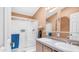 Bathroom featuring double sinks, a shower with glass doors, and neutral color walls at 2400 E Baseline Ave # 44, Apache Junction, AZ 85119
