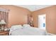 Cozy bedroom with a large bed, bedside tables, and access to the ensuite bathroom at 2400 E Baseline Ave # 44, Apache Junction, AZ 85119