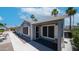 Desirable single-story home features a welcoming porch and well-maintained landscaping in a desirable location at 2400 E Baseline Ave # 44, Apache Junction, AZ 85119