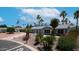 Beautiful single story home with well-manicured landscaping and views of palm trees and mountains at 2400 E Baseline Ave # 44, Apache Junction, AZ 85119