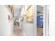 Hallway decorated with hanging art and leading to a bedroom at 2400 E Baseline Ave # 44, Apache Junction, AZ 85119