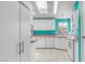 Bright and airy kitchen with white cabinets, modern appliances, and turquoise accents for a fresh, modern style at 2400 E Baseline Ave # 44, Apache Junction, AZ 85119
