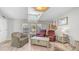 Bright living room features ample natural light and beautiful hardwood floors creating a warm and inviting atmosphere at 2400 E Baseline Ave # 44, Apache Junction, AZ 85119