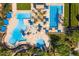 Aerial view of multiple community pools surrounded by blue shade structures, lush trees, and walking trails at 29007 N 120Th Dr, Peoria, AZ 85383