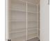 Walk-in pantry featuring multiple shelves for storing kitchen essentials at 29007 N 120Th Dr, Peoria, AZ 85383