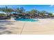 View of the community resort-style pool featuring lounge chairs and a water slide at 29007 N 120Th Dr, Peoria, AZ 85383