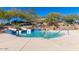 View of the community resort-style pool featuring lounge chairs and a water slide at 29007 N 120Th Dr, Peoria, AZ 85383