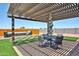 Inviting backyard with patio, dining set, and hot tub at 29408 N 224Th Dr, Wittmann, AZ 85361