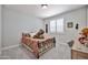 Comfortable bedroom featuring a plush carpet and soft, natural light at 29408 N 224Th Dr, Wittmann, AZ 85361