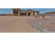 Charming single-story home with a well-manicured yard, desert landscaping, and a spacious driveway at 29408 N 224Th Dr, Wittmann, AZ 85361
